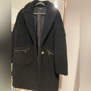 Long teddy misguided coat with zip pockets.